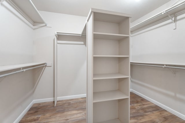 walk in closet featuring hardwood / wood-style floors