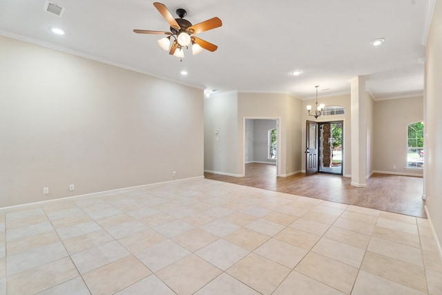 spare room featuring light hardwood / wood-style flooring, ceiling fan with notable chandelier, and ornamental molding