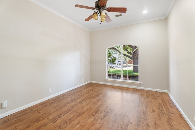 empty room with crown molding, ceiling fan, and wood-type flooring