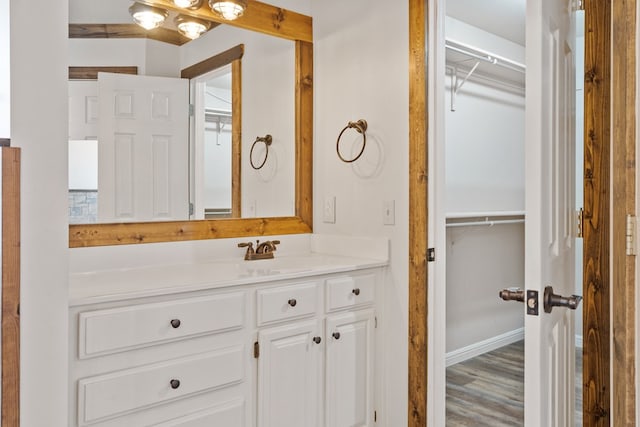 bathroom featuring hardwood / wood-style floors and vanity