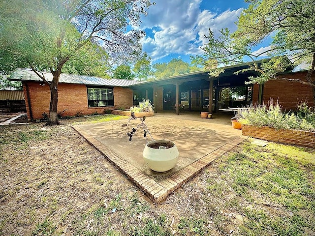 back of house with a patio area