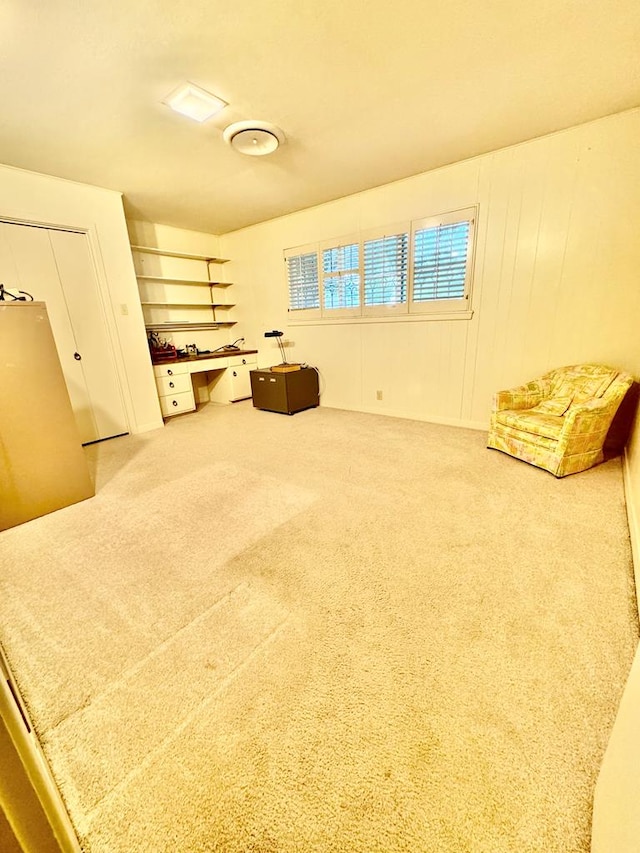 sitting room with carpet flooring