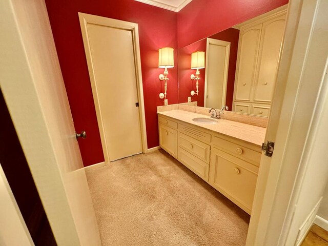 bathroom with vanity and ornamental molding