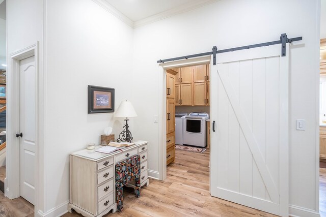2223 S 2nd Pl, Lamesa, TX 79331 - corridor featuring ornamental molding, baseboards, washing machine and clothes dryer, a barn door, and light wood-style flooring