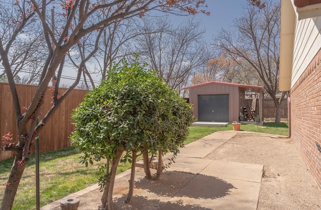2223 S 2nd Pl, Lamesa, TX 79331 - view of yard featuring an outdoor structure and a fenced backyard