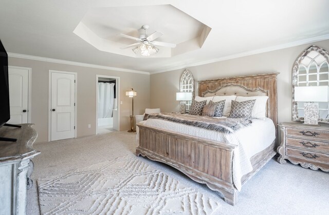 2223 S 2nd Pl, Lamesa, TX 79331 - bedroom with a tray ceiling, ensuite bath, crown molding, and carpet flooring