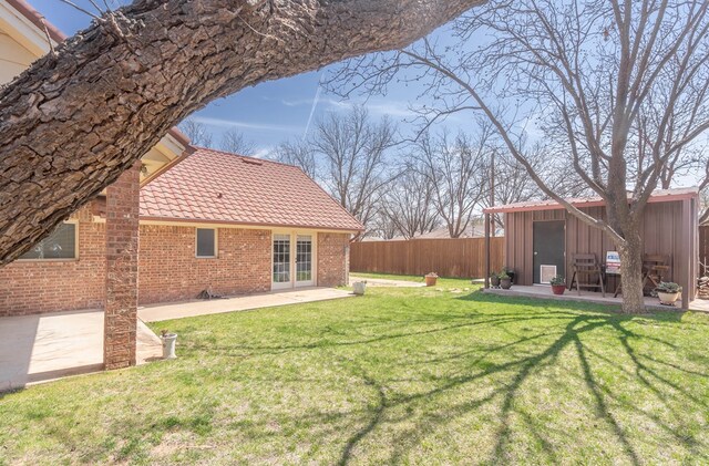 2223 S 2nd Pl, Lamesa, TX 79331 - view of yard featuring fence, french doors, and a patio