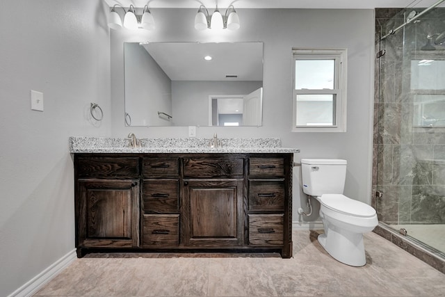 bathroom with toilet, walk in shower, and vanity