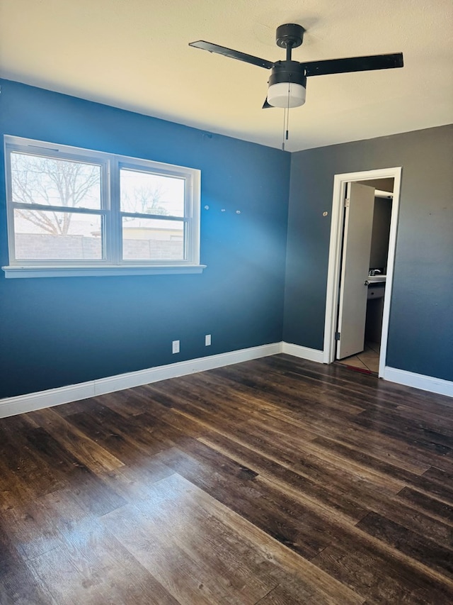 unfurnished bedroom featuring a ceiling fan, baseboards, and wood finished floors