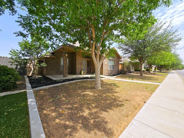 view of front of property featuring brick siding
