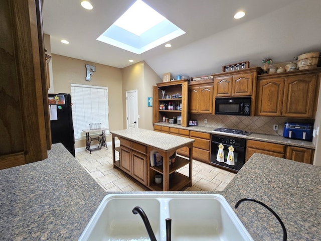kitchen featuring open shelves, decorative backsplash, a center island, black appliances, and a skylight