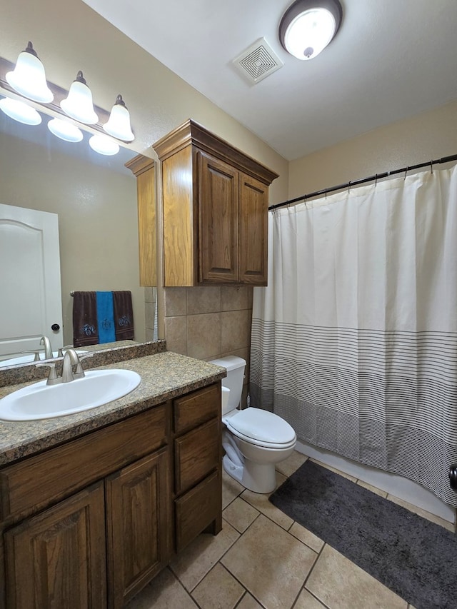 bathroom with visible vents, tile patterned flooring, vanity, toilet, and a shower with shower curtain