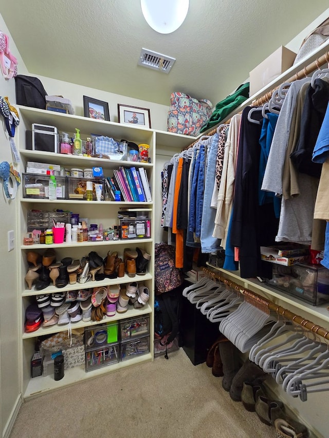 spacious closet with carpet and visible vents