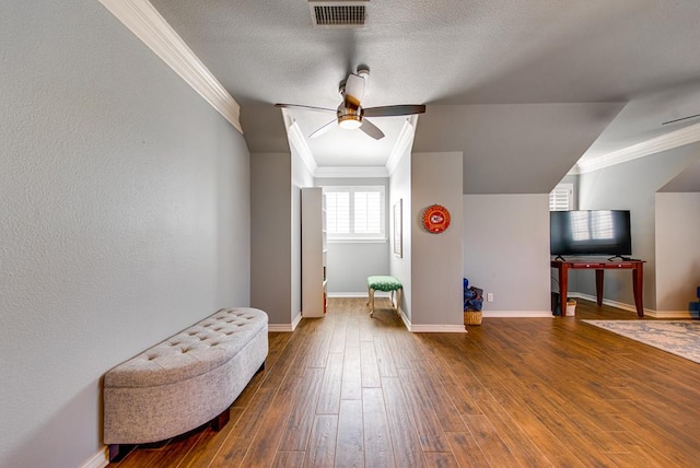 bonus room featuring baseboards, ceiling fan, visible vents, and hardwood / wood-style flooring