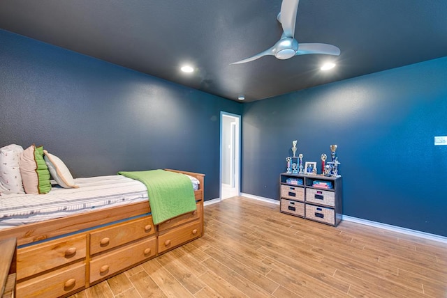 bedroom with light wood-style floors, baseboards, ceiling fan, and recessed lighting