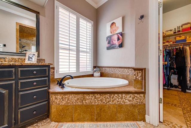 bathroom with crown molding, vanity, a spacious closet, and a bath