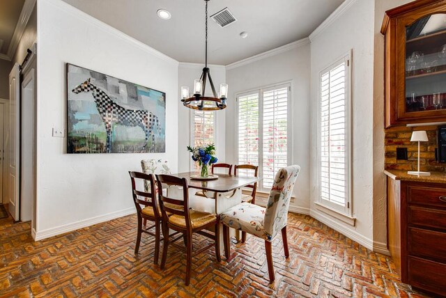 dining space with baseboards, a healthy amount of sunlight, visible vents, and brick floor