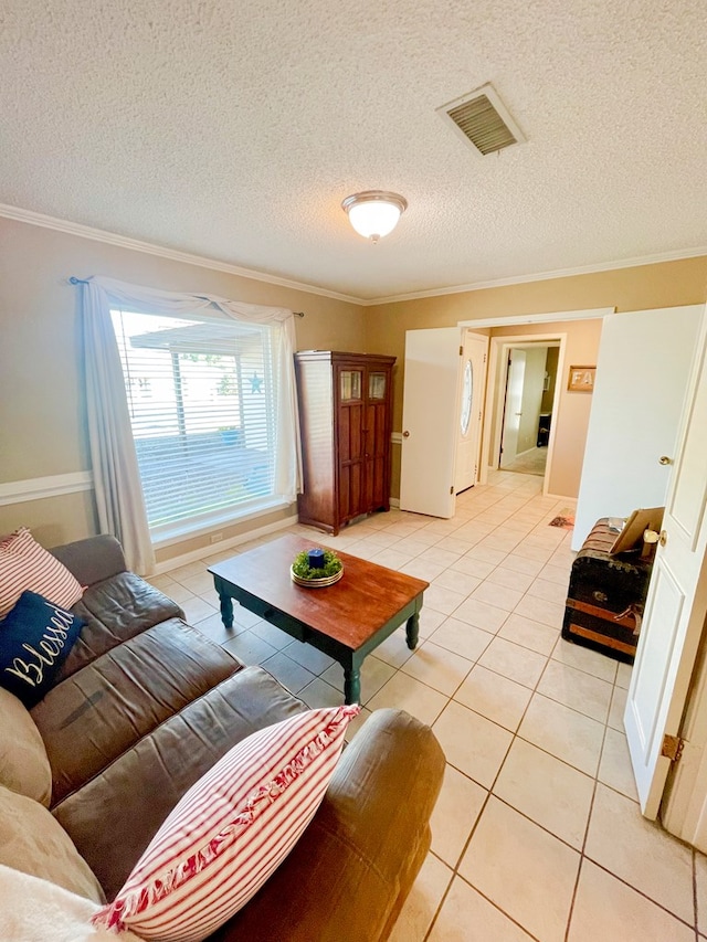 tiled living room featuring crown molding and a textured ceiling