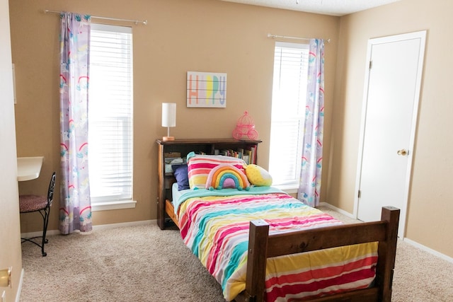 bedroom with light colored carpet