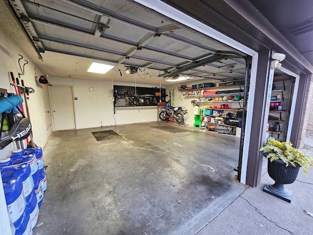 garage featuring a garage door opener