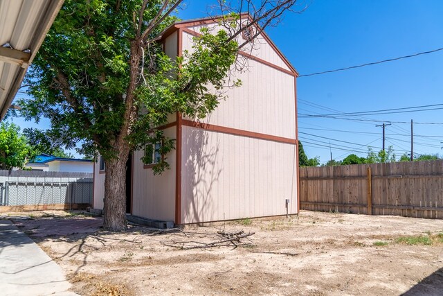 view of home's exterior featuring a storage shed