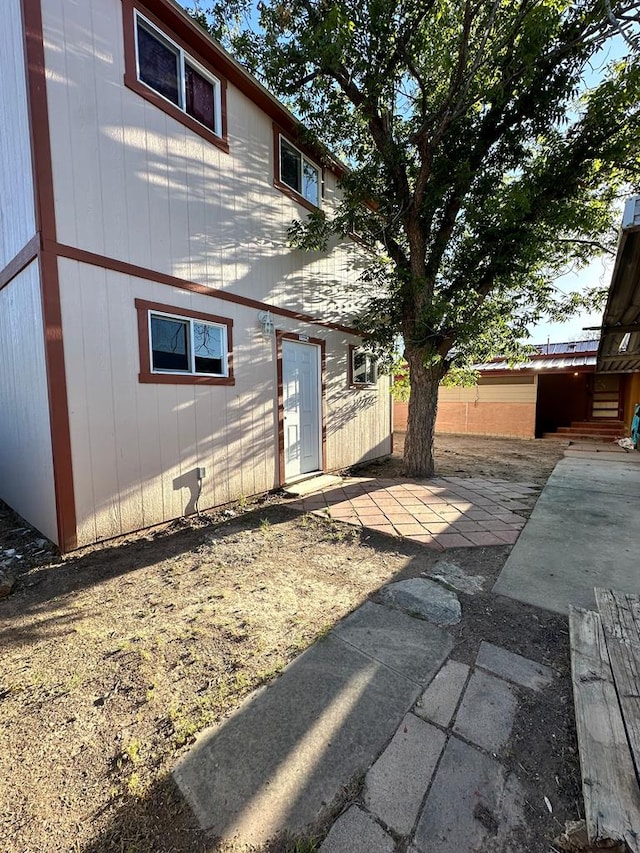 back of property with a patio area