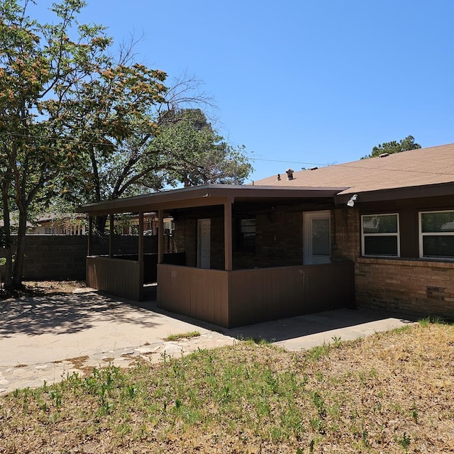 801 W Golf Course Rd, Midland, TX 79701 - rear view of house with brick siding