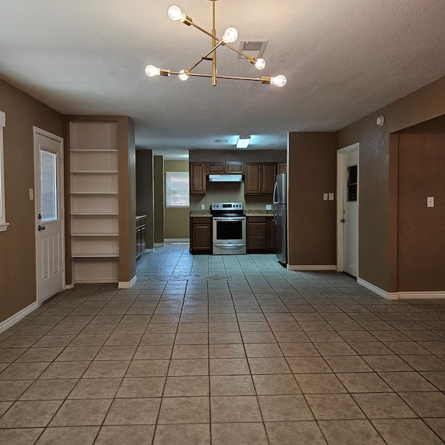 801 W Golf Course Rd, Midland, TX 79701 - kitchen featuring appliances with stainless steel finishes, a chandelier, under cabinet range hood, a textured ceiling, and baseboards