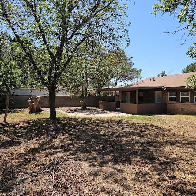 801 W Golf Course Rd, Midland, TX 79701 - view of yard featuring a sunroom