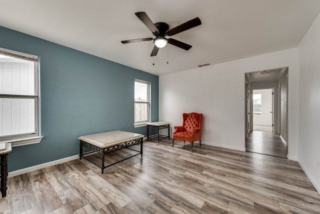 3004 W 4th, Odessa, TX 79763 - living area with healthy amount of natural light, a ceiling fan, and wood finished floors