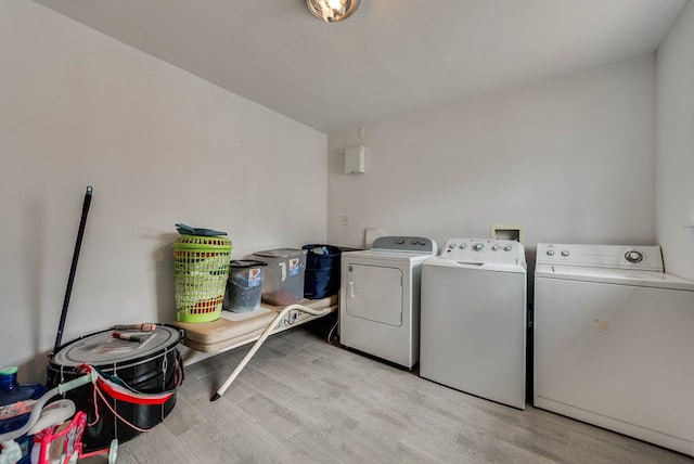 3004 W 4th, Odessa, TX 79763 - laundry area featuring washing machine and clothes dryer and light wood-style floors