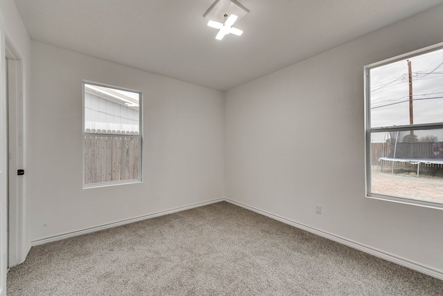 3004 W 4th, Odessa, TX 79763 - unfurnished room with healthy amount of natural light and carpet floors