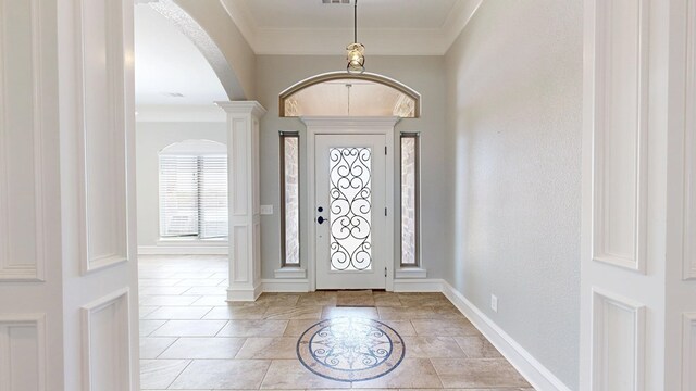 2894 SE 5001, Andrews, TX 79714 - foyer with arched walkways, baseboards, and ornamental molding