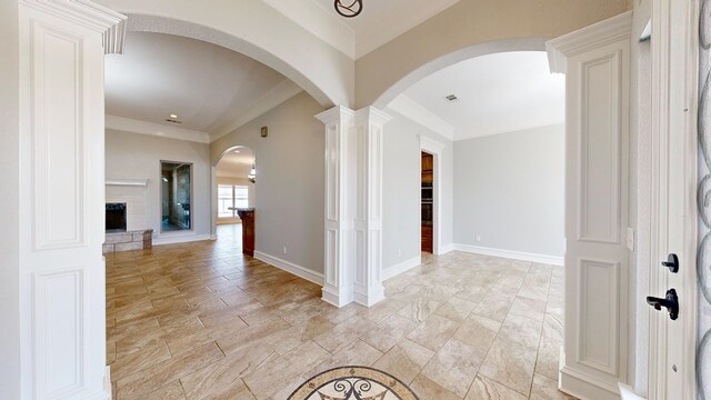 2894 SE 5001, Andrews, TX 79714 - hallway with arched walkways, ornamental molding, ornate columns, and baseboards
