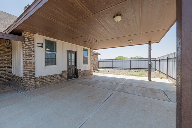 2894 SE 5001, Andrews, TX 79714 - fenced backyard with a patio area and a carport
