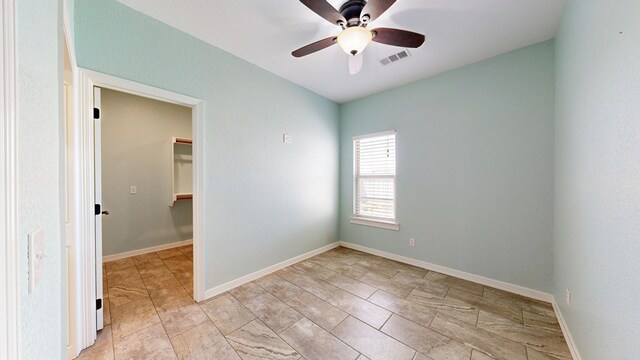 2894 SE 5001, Andrews, TX 79714 - spare room featuring ceiling fan and baseboards
