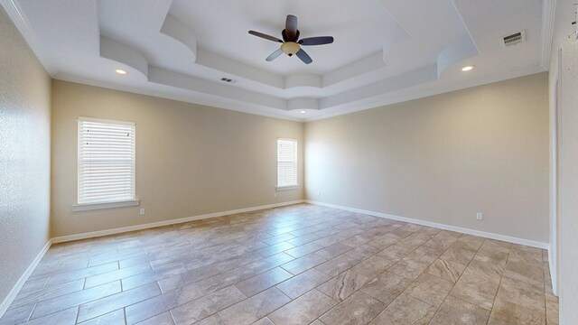2894 SE 5001, Andrews, TX 79714 - empty room with ceiling fan, a raised ceiling, recessed lighting, and baseboards
