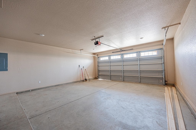 2894 SE 5001, Andrews, TX 79714 - garage with a garage door opener, baseboards, and electric panel