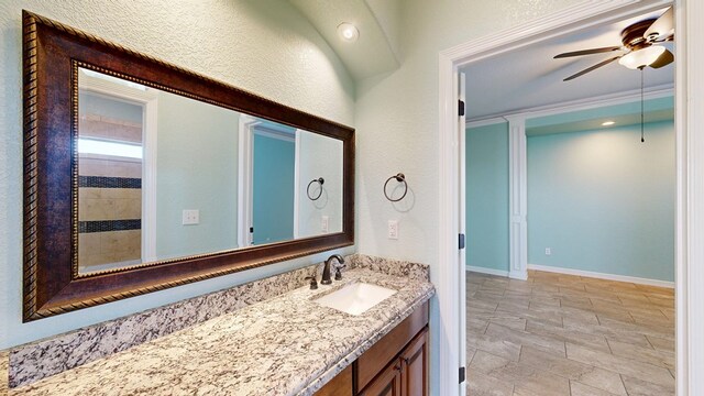 2894 SE 5001, Andrews, TX 79714 - full bath with vanity, a ceiling fan, and a textured wall