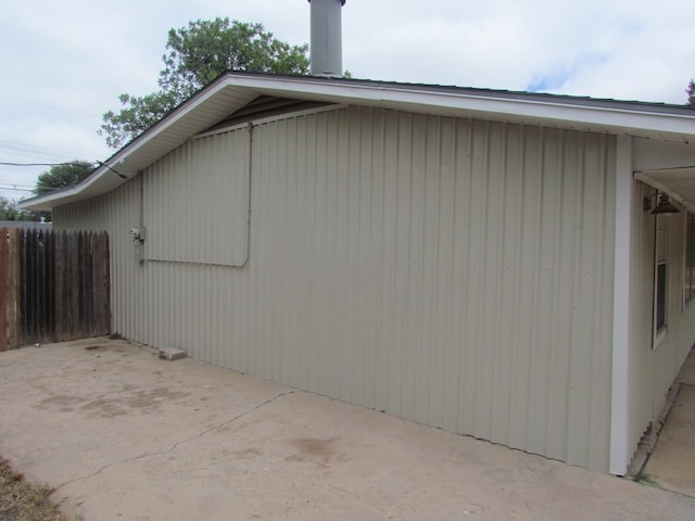 view of side of home featuring a patio