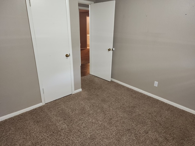 unfurnished bedroom with carpet flooring