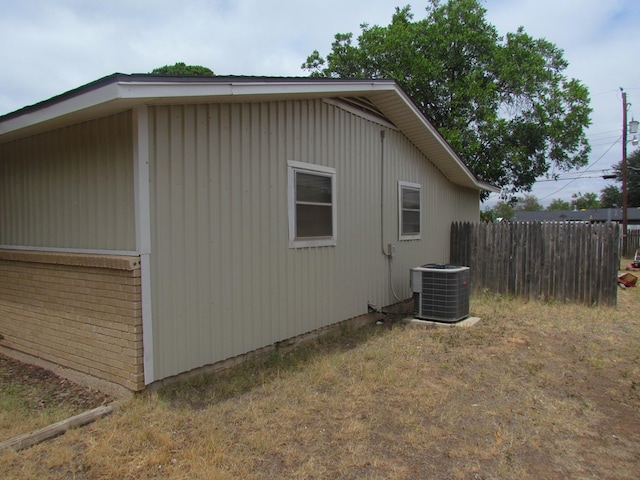 view of side of home with cooling unit