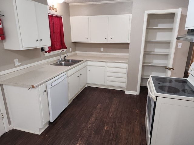 kitchen featuring white cabinets, white appliances, dark hardwood / wood-style floors, and sink