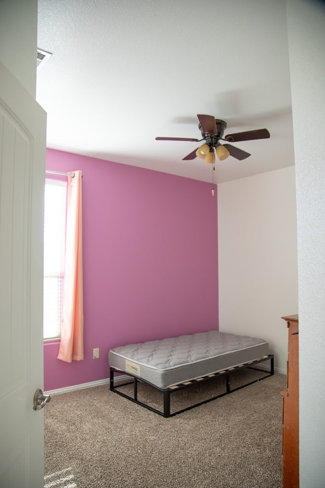 bedroom featuring ceiling fan and carpet floors