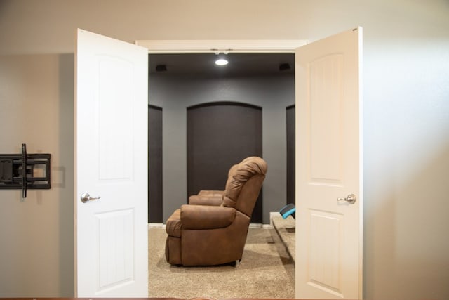 sitting room featuring carpet flooring