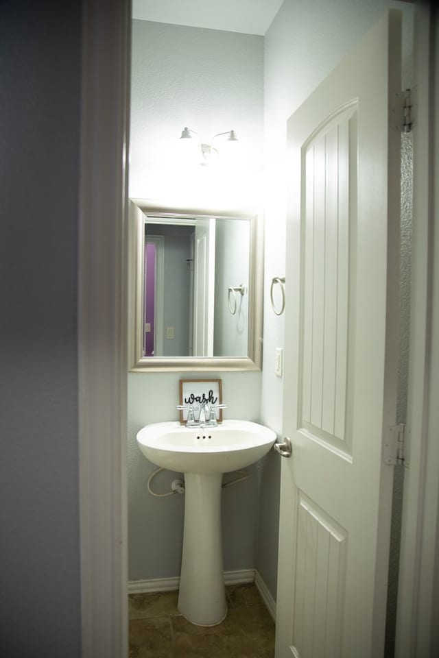 bathroom with tile patterned floors