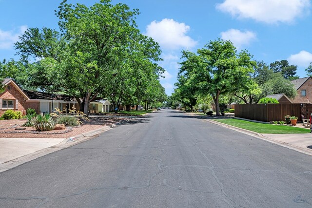 2512 Sinclair Ave, Midland, TX 79705 - view of asphalt road featuring curbs