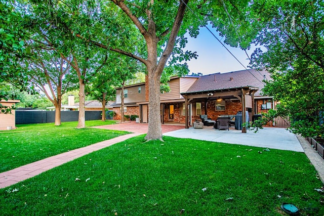 2512 Sinclair Ave, Midland, TX 79705 - back of property with a patio area, outdoor lounge area, and brick siding