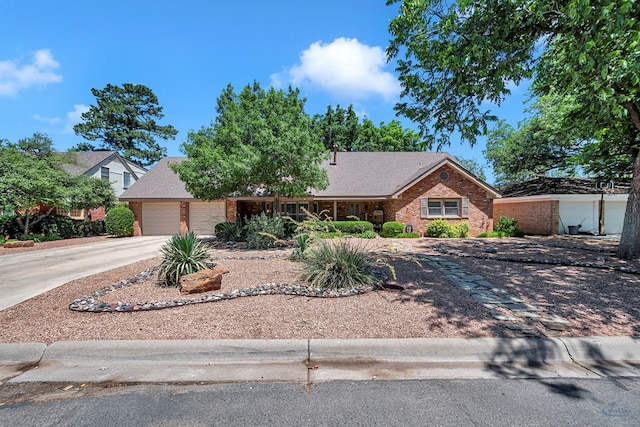2512 Sinclair Ave, Midland, TX 79705 - single story home with a garage, concrete driveway, and brick siding