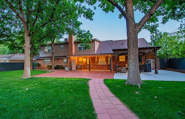 2512 Sinclair Ave, Midland, TX 79705 - back of property featuring a patio area and brick siding
